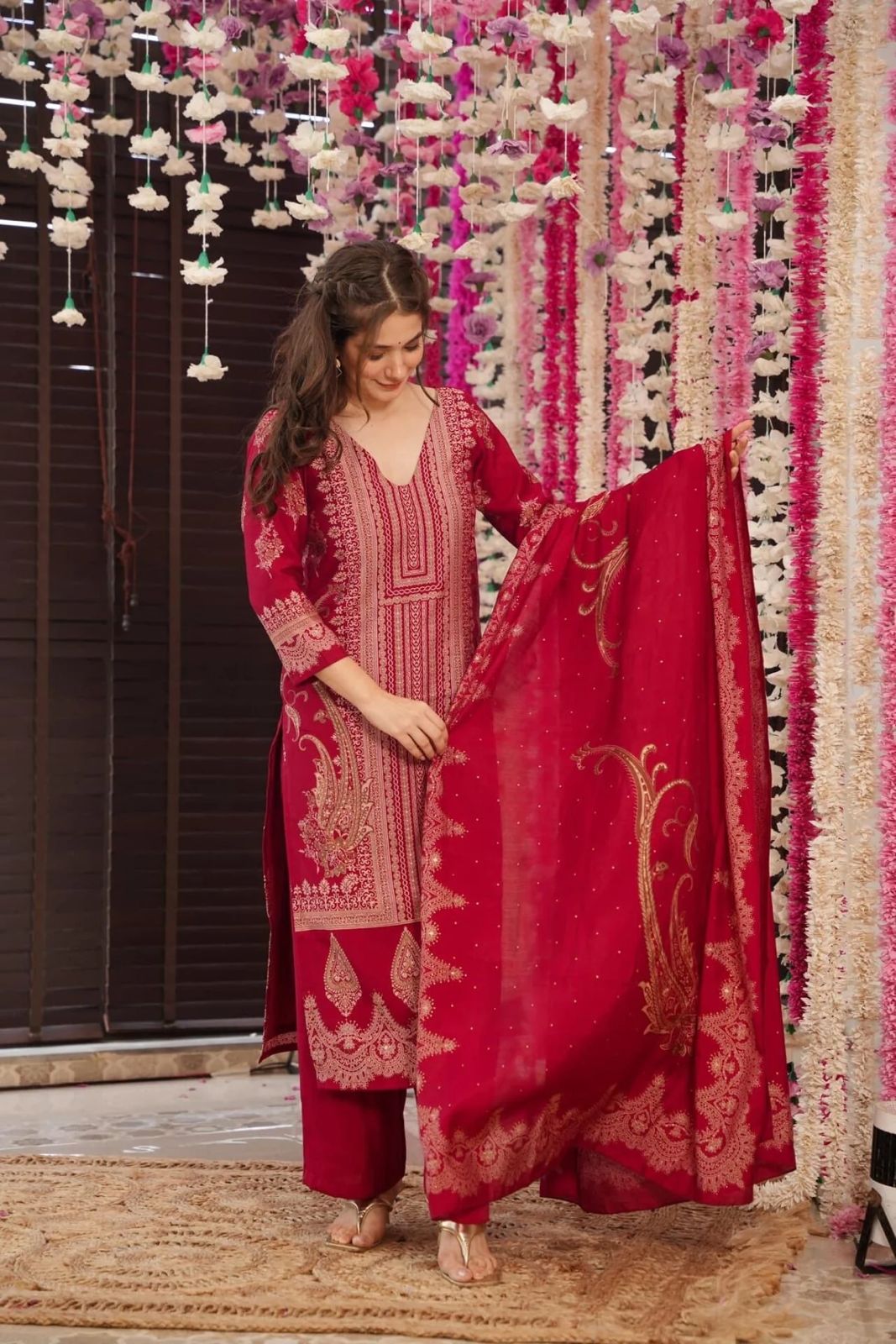 The showcases a beautiful and elegant Indian ethnic wear set. The combination of gold accents creates a sophisticated and timeless look