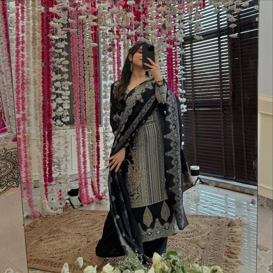 The showcases a beautiful and elegant Indian ethnic wear set. The combination of gold accents creates a sophisticated and timeless look