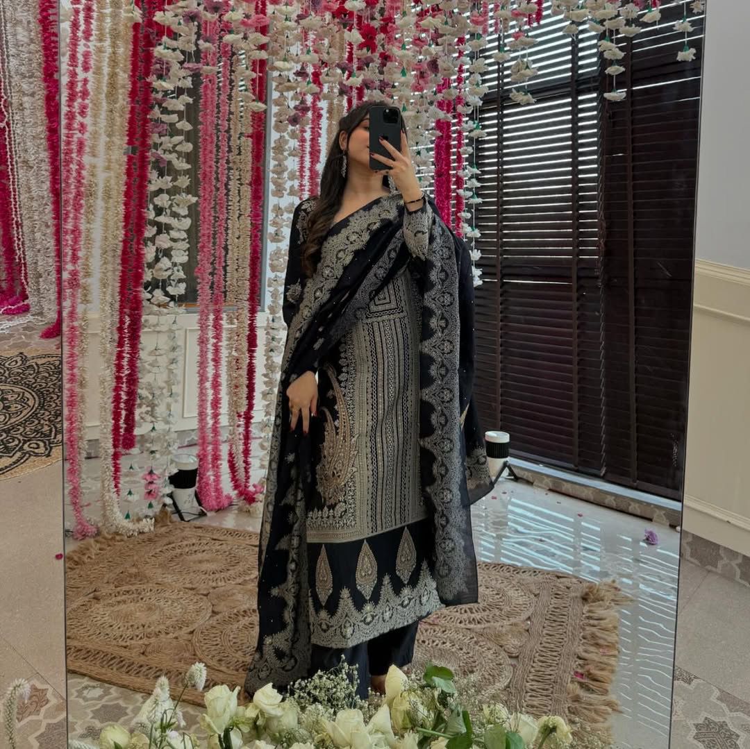 The showcases a beautiful and elegant Indian ethnic wear set. The combination of gold accents creates a sophisticated and timeless look