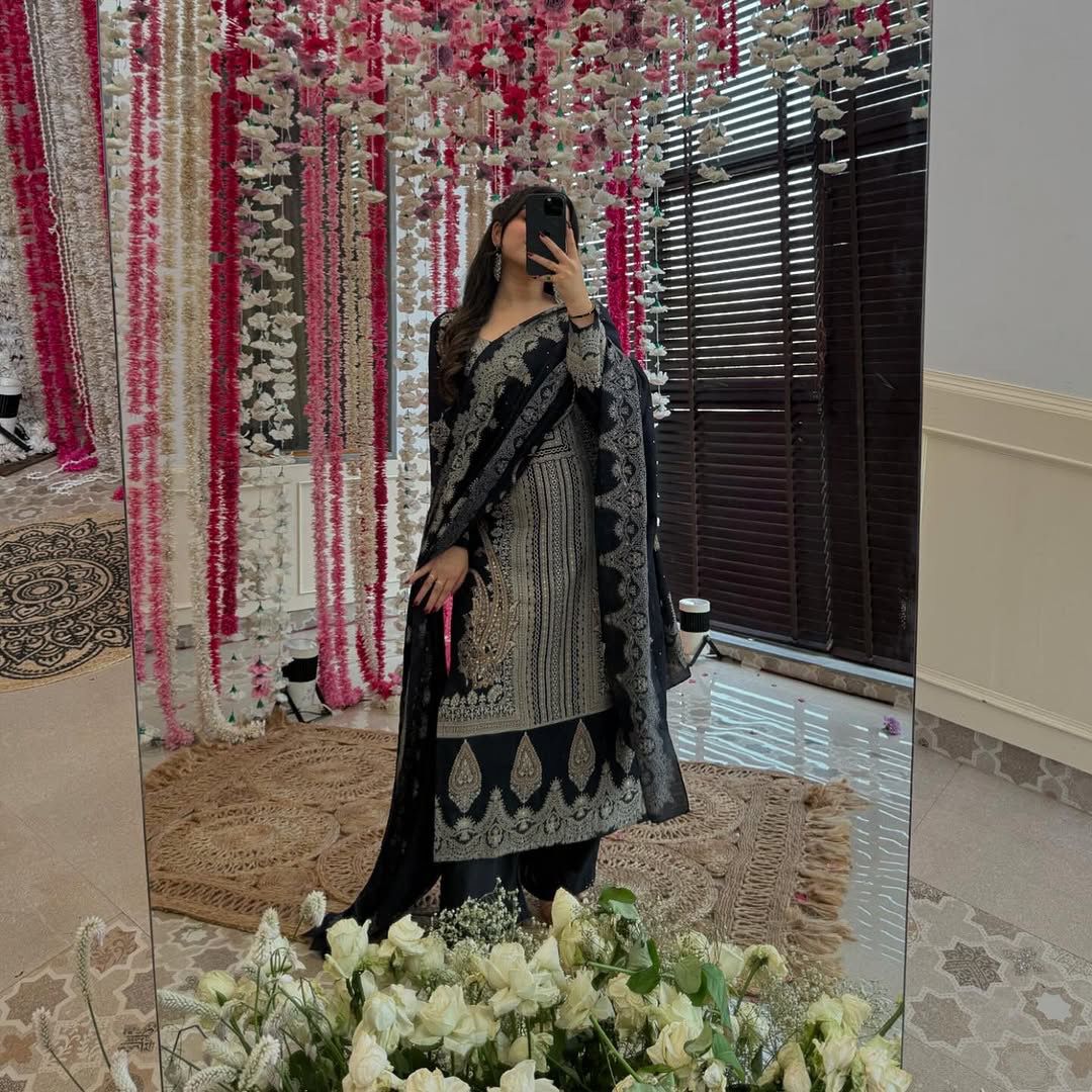 The showcases a beautiful and elegant Indian ethnic wear set. The combination of gold accents creates a sophisticated and timeless look