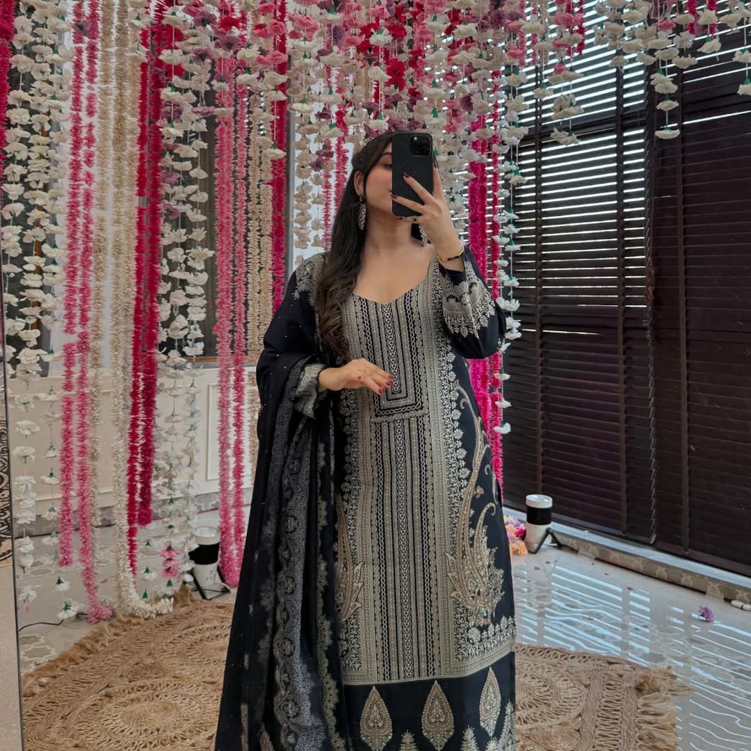 The showcases a beautiful and elegant Indian ethnic wear set. The combination of gold accents creates a sophisticated and timeless look