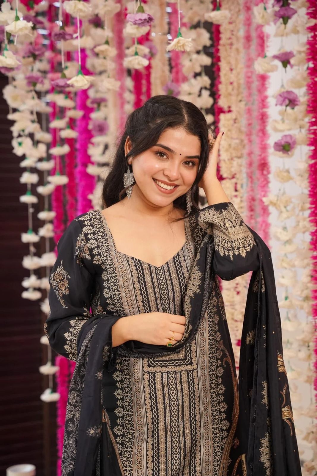 The showcases a beautiful and elegant Indian ethnic wear set. The combination of gold accents creates a sophisticated and timeless look