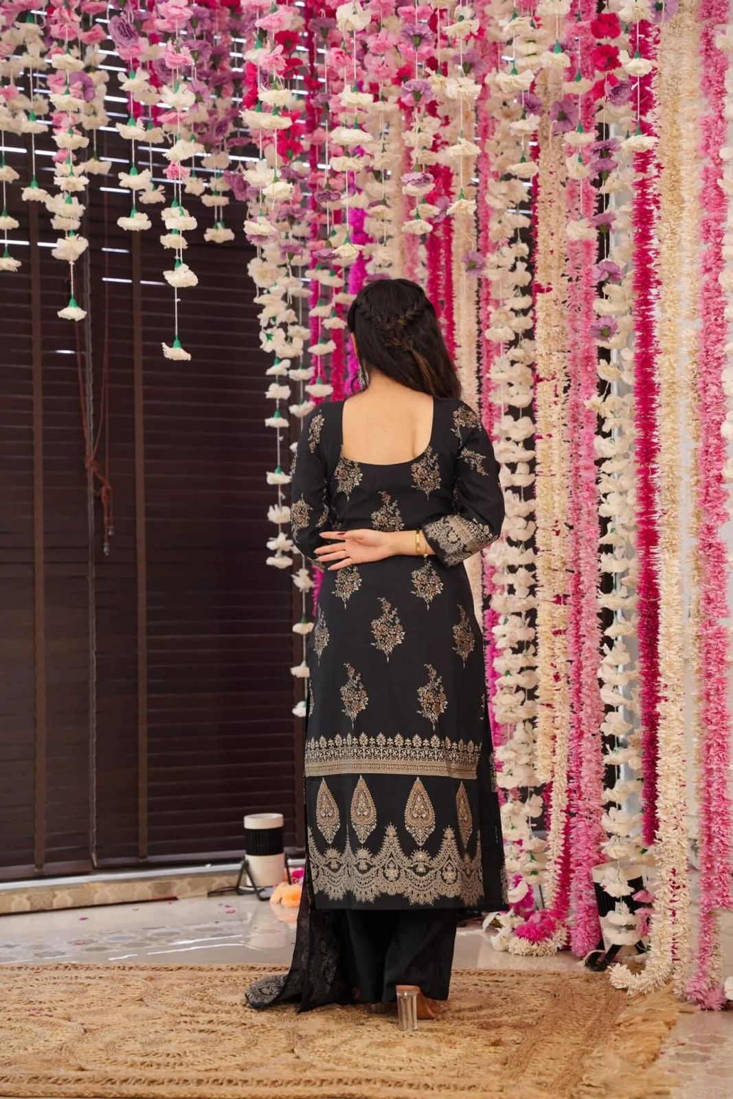 The showcases a beautiful and elegant Indian ethnic wear set. The combination of gold accents creates a sophisticated and timeless look